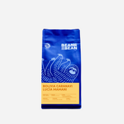 Purple "Bean & Bean Coffee Roasters" bag with a colored label that says Bolivia Lucia Mamani