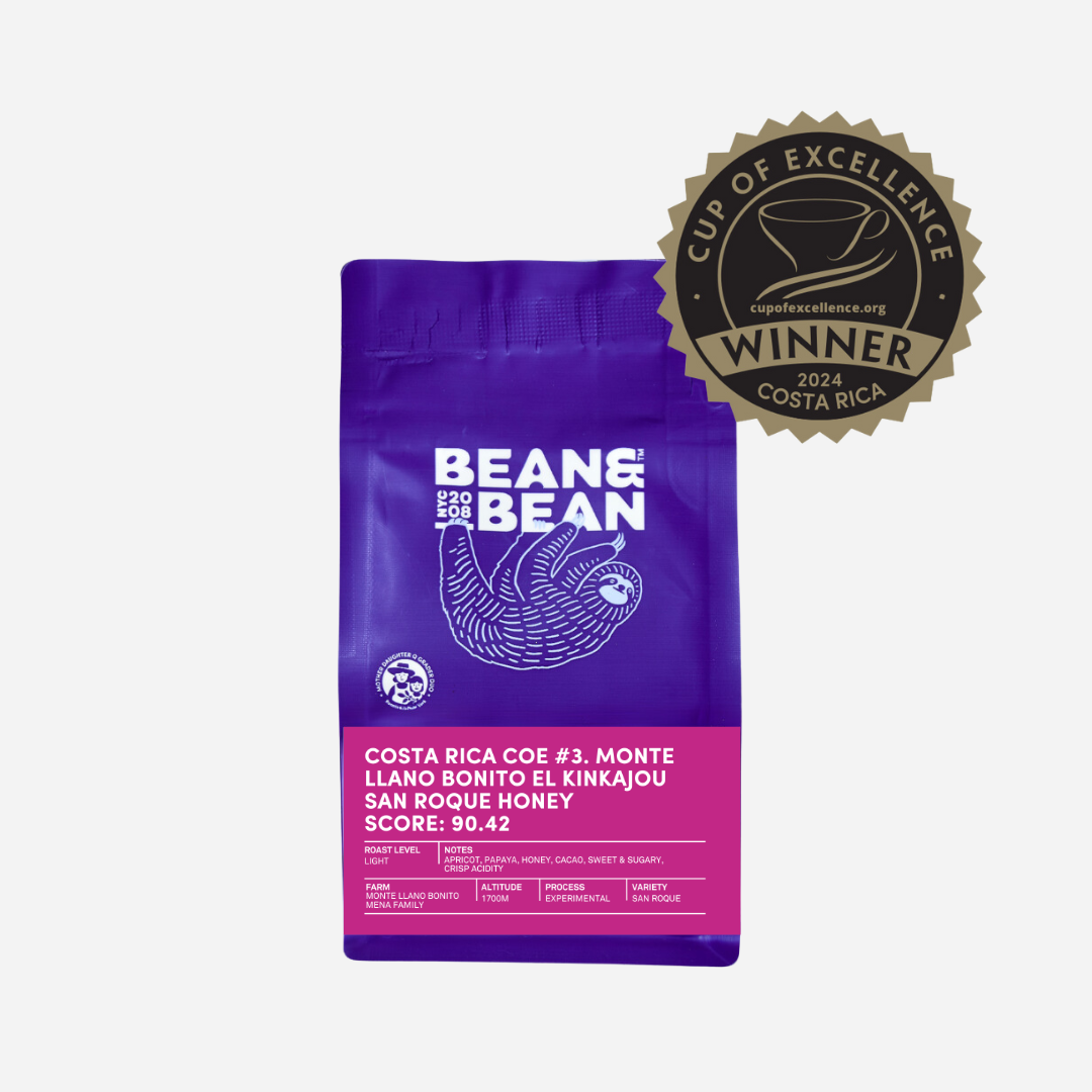 Purple "Bean & Bean Coffee Roasters" bag with a colored label that says Costa Rica Cup of Excellence #3 Experimental [Score 90.42]