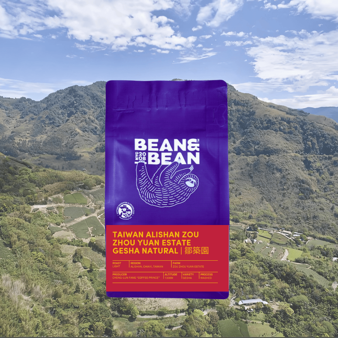 Purple "Bean & Bean Coffee Roasters" bag with a colored label that says Taiwan Alishan Zou Zhou Yuan Estate Gesha Natural 鄒築園