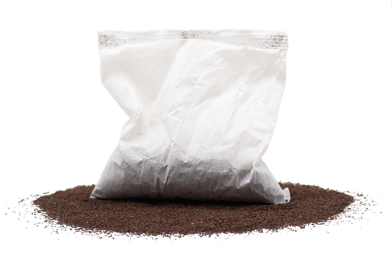 White tea filter on a bed of black tea